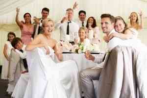 Happy bride and groom with guests